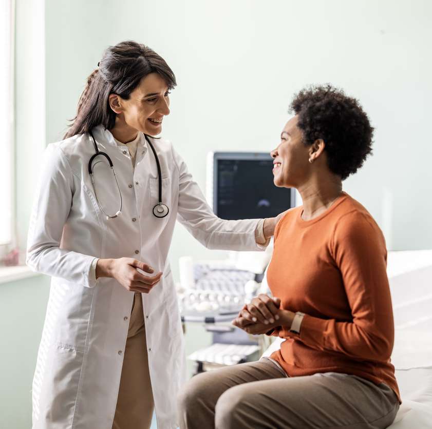 Dr. Howard consulting with a patient